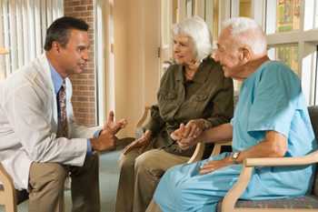 	Photo: Doctor speaking to an older couple
