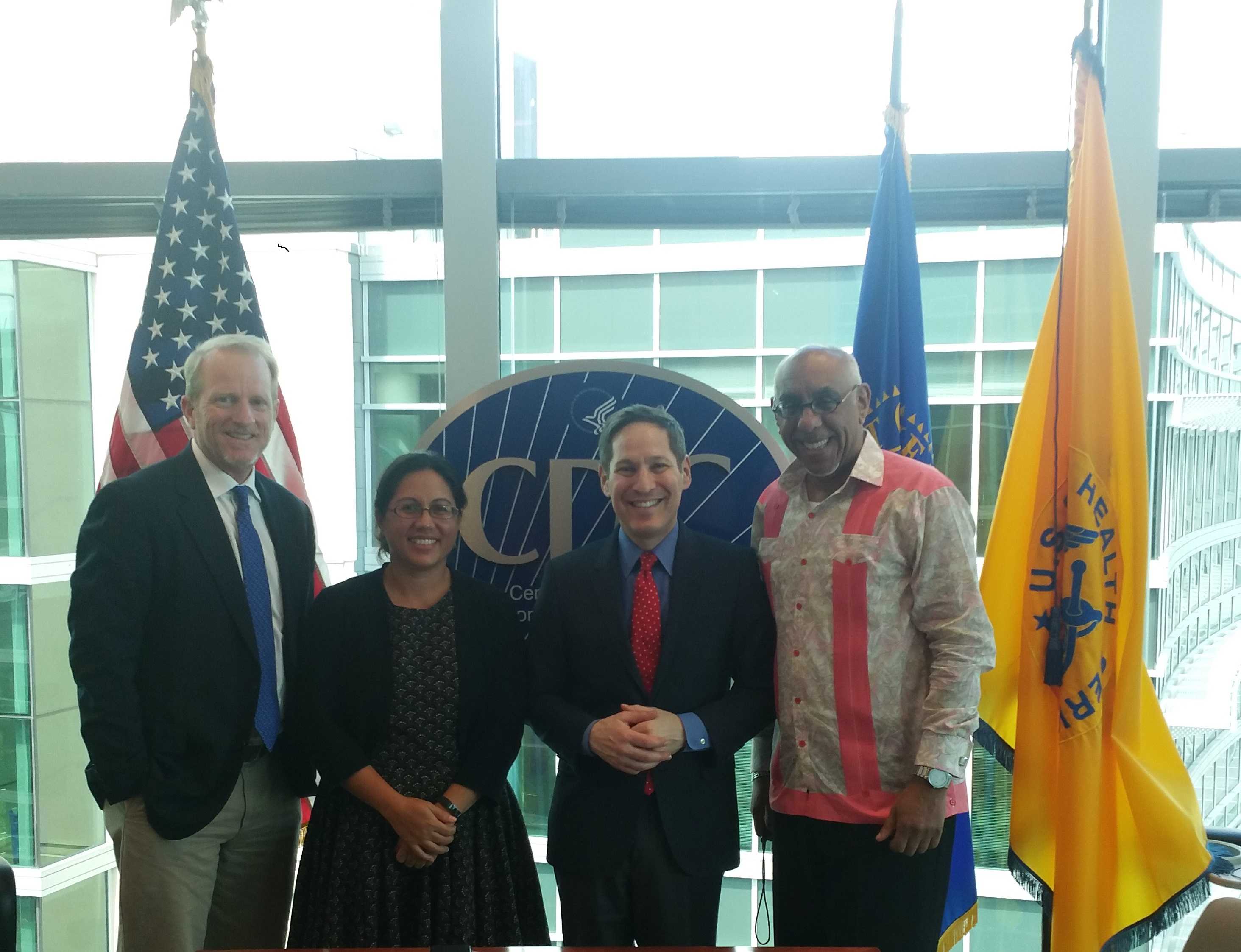    PIHOA Executive Director Emi Chutaro (2nd from left} and members of the OSTLTS Partnership Support Unit visit with CDC Director Dr. Tom Frieden (2nd from right) at CDC Headquarters 