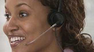 Woman speaking on phone with headset
