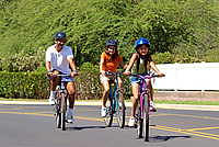 Family biking on a street