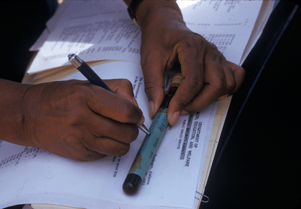 man's hands labeling blood sample