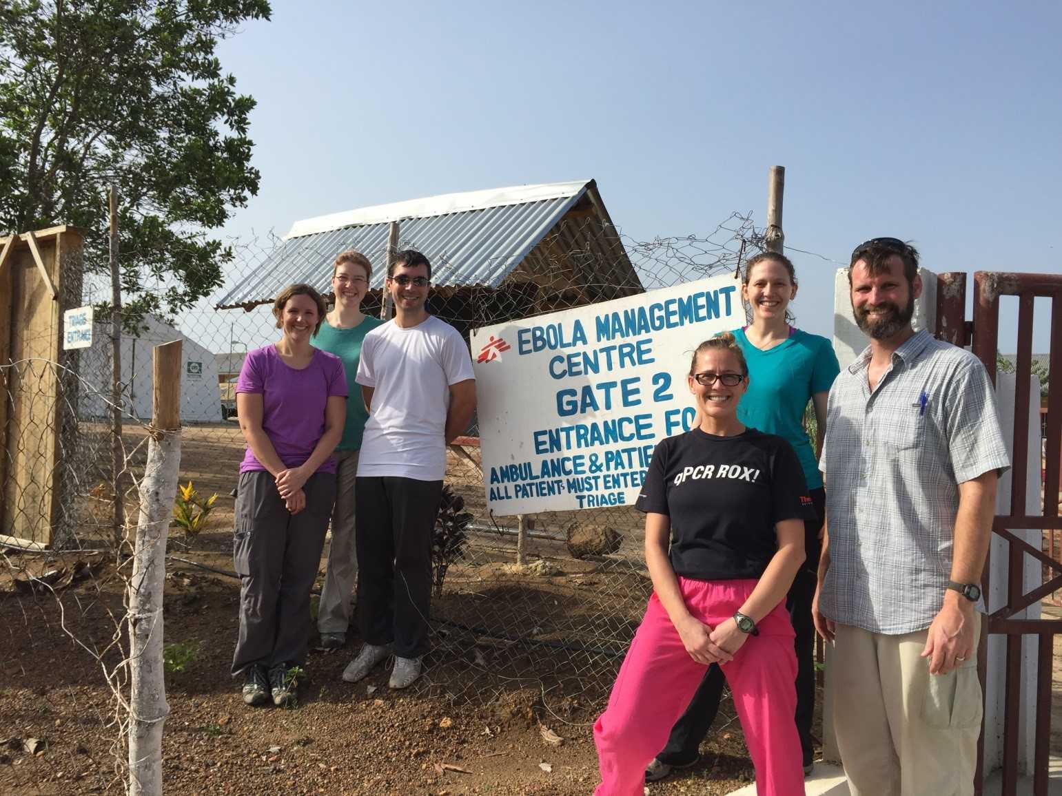 	Members of the Bo lab (Team 12) standing in front of the entrance to the Médecins Sans Frontières compound, where the lab is located. (Left to right) Janae Stovall, Laura Rose, Marko Zivcec, Lauren Andersen, Shannon Emery, and Brian Bird