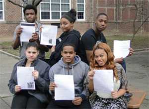Group of students holding letters written to CDC