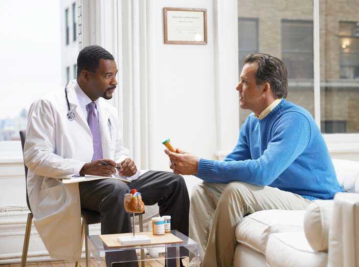 Doctor talking with a patient about his medicine