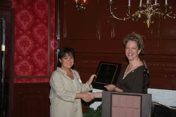Virginia Swezy receives the award for Outstanding PHA, 2006, from WS President, Stacy Harper