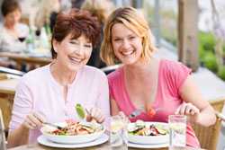 two women enjoying a meal together