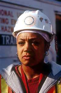 female cleanup worker wearing hard hat