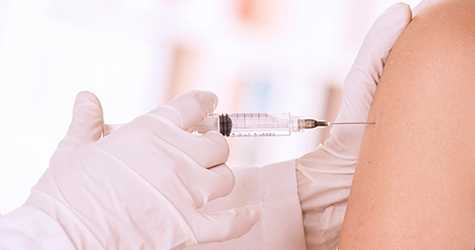 Person getting a vaccine in the arm